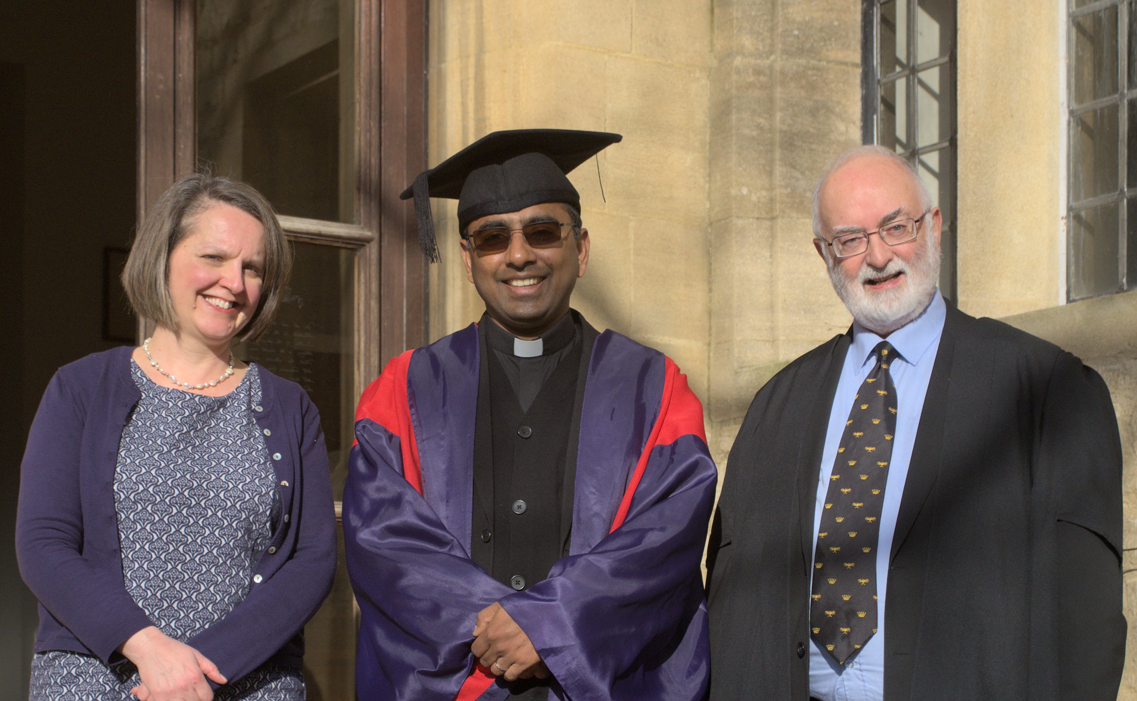 Rev Dr Jiji Joseph, SJ (DPhil Oriental Studies) celebrates with Dr Sarah Apetrei and Revd Dr Patrick Riordan, SJ