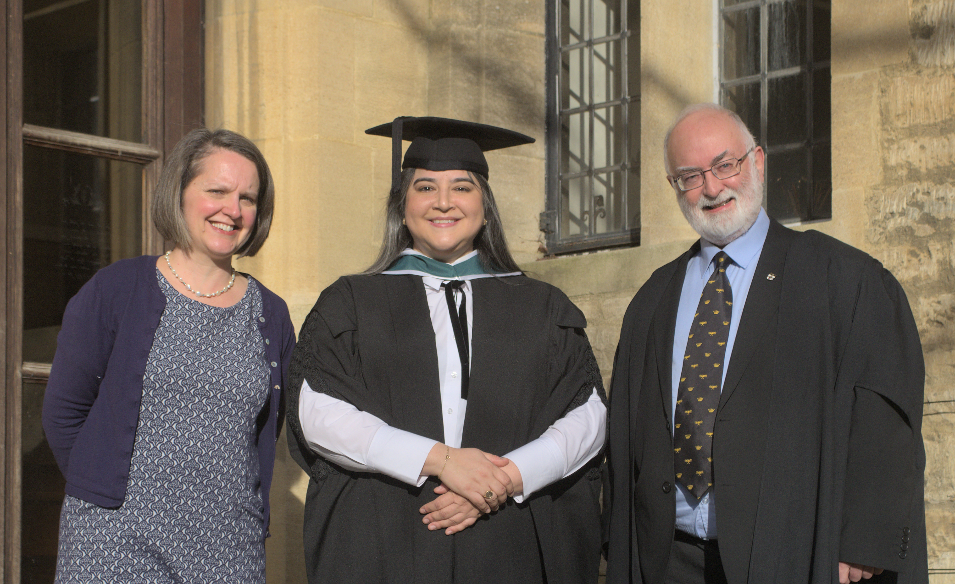 Christina Lisigakis (MSt Diplomatic Studies) celebrates with Dr Sarah Apetrei and Revd Dr Patrick Riordan, SJ
