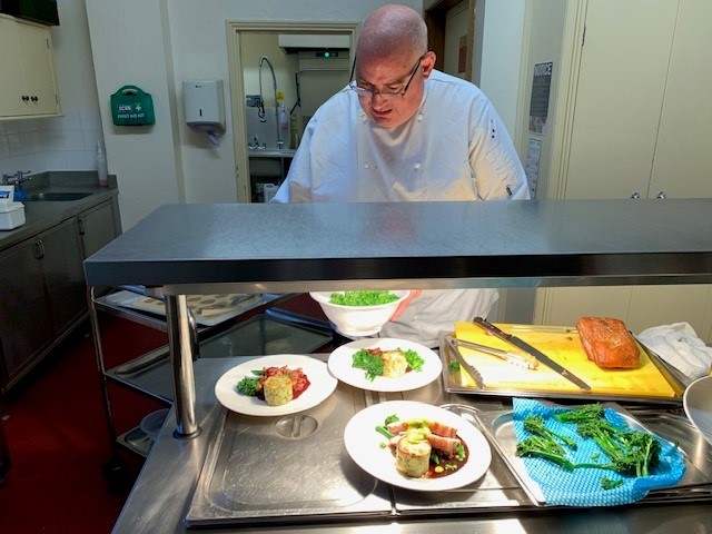 Keir, serving lunch at the hot plate