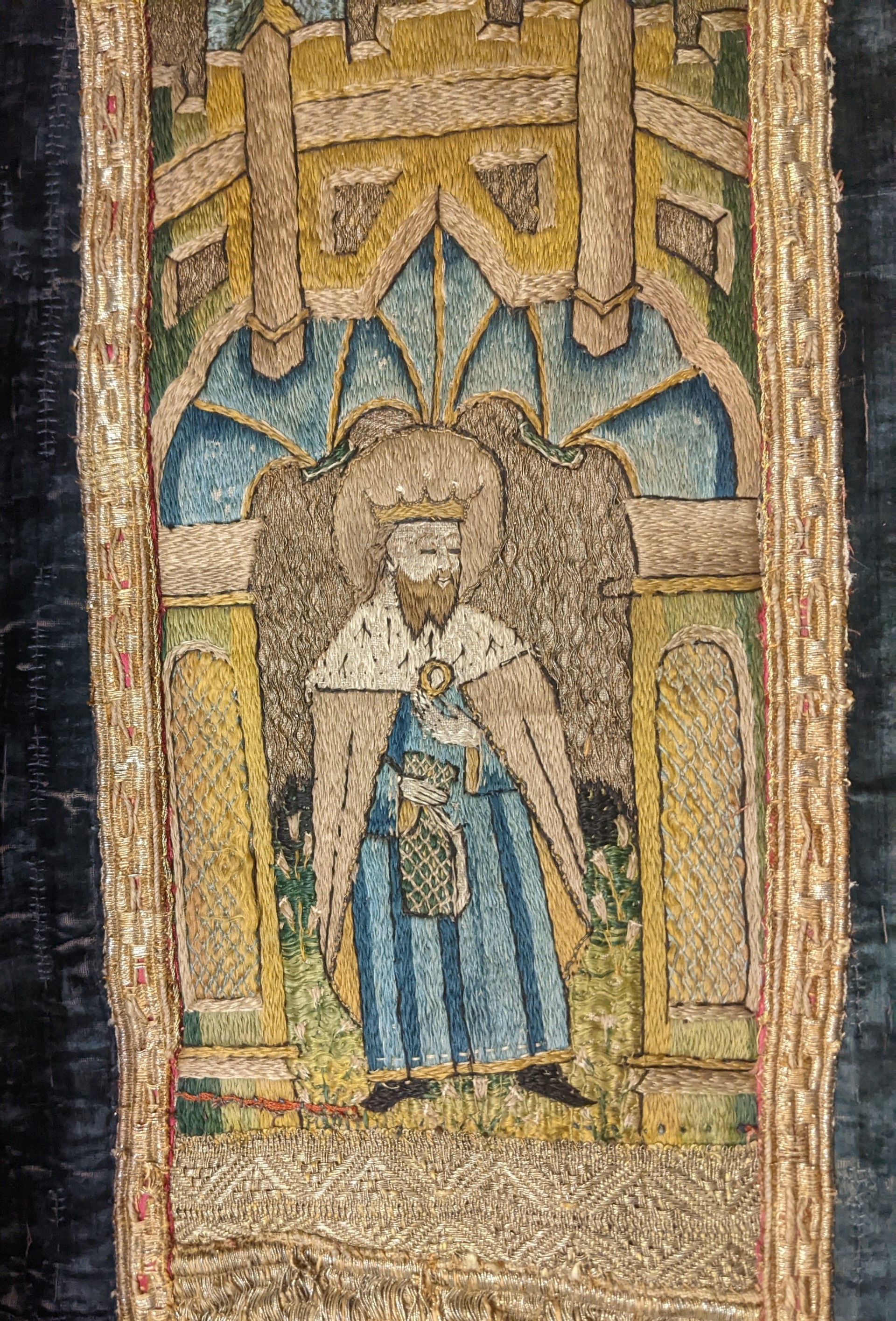 A close-up of St. Edward the Confessor with a ring on the Basset vestment.