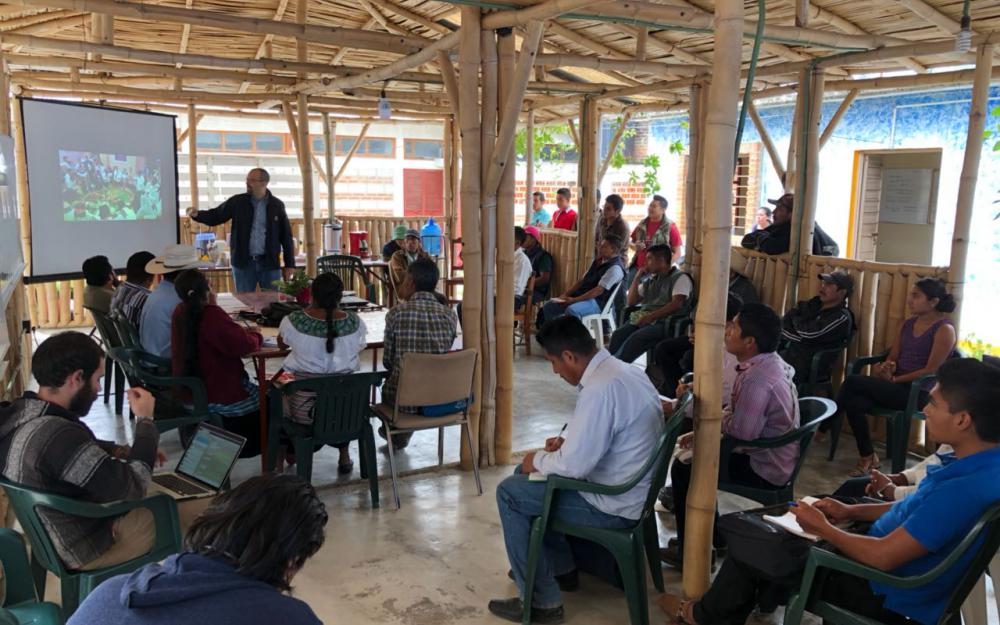 Alumnus presenting to group of people in Chiapas